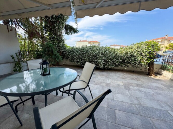 Modern one-bedroom apartment with stylish living room, fully equipped kitchen, terrace, and contemporary design for a comfortable stay in Moudania.