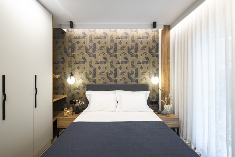 Modern one-bedroom apartment with stylish living room, fully equipped kitchen, private balcony, and contemporary design for a comfortable stay in Thessaloniki.