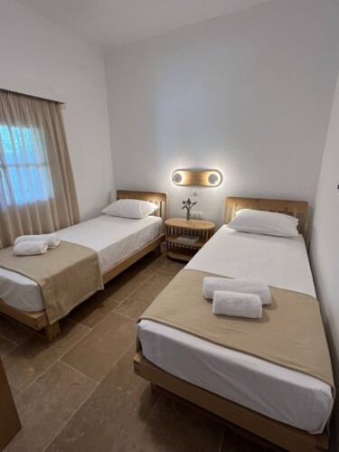 Cozy holiday home with modern kitchen, comfortable living room, bright bedroom, and private garden, ideal for a relaxing stay in Skiathos