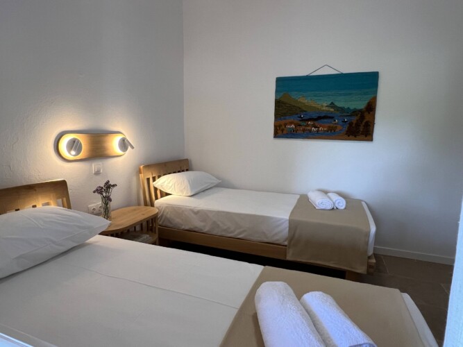 Cozy holiday home with modern kitchen, comfortable living room, bright bedroom, and private garden, ideal for a relaxing stay in Skiathos