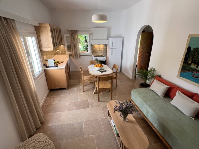 Cozy holiday home with modern kitchen, comfortable living room, bright bedroom, and private garden, ideal for a relaxing stay in Skiathos