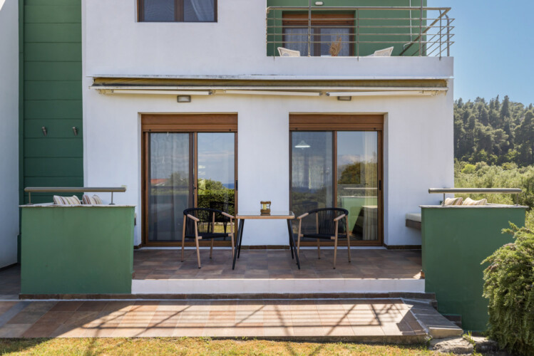 Frida & Rosa villas in Kripogi offering modern two-level holiday homes with private gardens and comfortable living spaces for a relaxing getaway in Halkidiki.