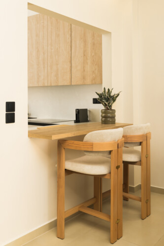 Ivory premium two-bedroom apartment on Leoforos Nikis in Thessaloniki with elegant design, sea views, and modern amenities for a luxurious stay.