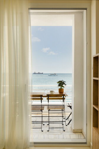 Ivory premium two-bedroom apartment on Leoforos Nikis in Thessaloniki with elegant design, sea views, and modern amenities for a luxurious stay.