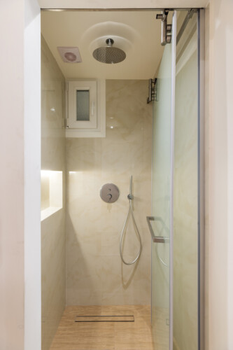 Ivory premium two-bedroom apartment on Leoforos Nikis in Thessaloniki with elegant design, sea views, and modern amenities for a luxurious stay.