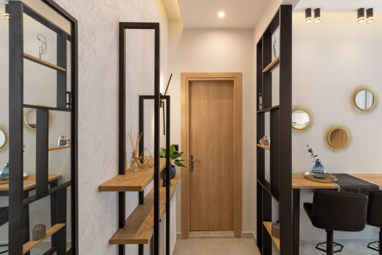 Modern two-bedroom apartment with stylish living room, fully equipped kitchen, balcony, and contemporary design for a comfortable stay in Thessaloniki.