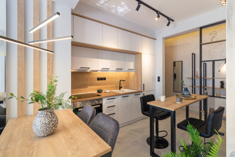 Modern two-bedroom apartment with stylish living room, fully equipped kitchen, balcony, and contemporary design for a comfortable stay in Thessaloniki.