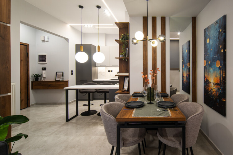 Modern two-bedroom apartment with stylish living room, fully equipped kitchen, balcony, and contemporary design for a comfortable stay in Thessaloniki.