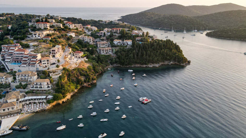 Drone view of iconic paradise sandy beaches with turquoise sea in complex islands. Aerial drone photo of paradise bay and complex islands of Sivota a popular summer destination, Ionian, Greece