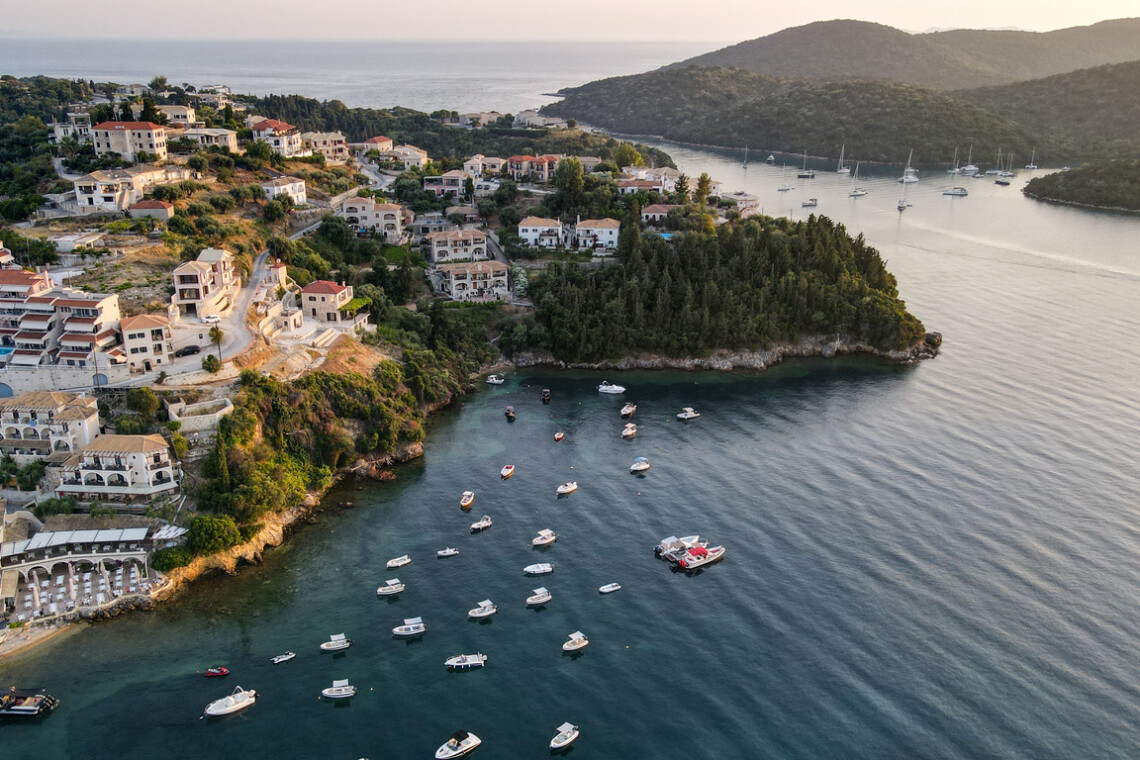 Drone view of iconic paradise sandy beaches with turquoise sea in complex islands. Aerial drone photo of paradise bay and complex islands of Sivota a popular summer destination, Ionian, Greece