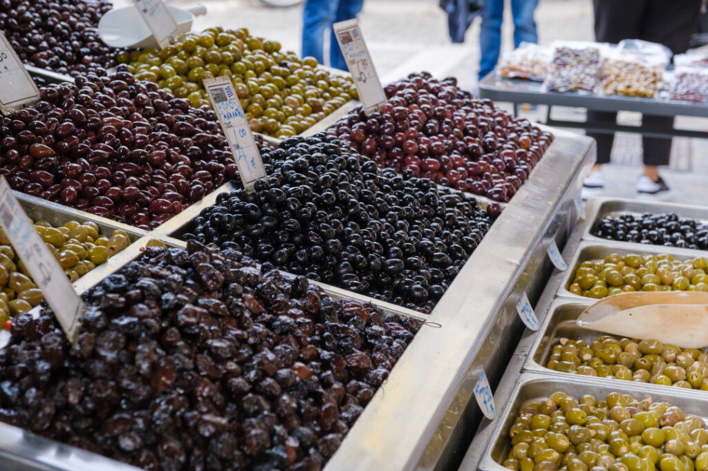 Variety of olives on display at a local market stall in Thessaloniki.