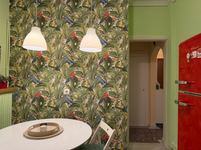 Modern one-bedroom apartment in the center of Thessaloniki with stylish living space, comfortable bed, and capacity for up to four guests.