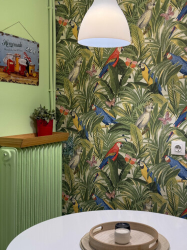 Modern one-bedroom apartment in the center of Thessaloniki with stylish living space, comfortable bed, and capacity for up to four guests.