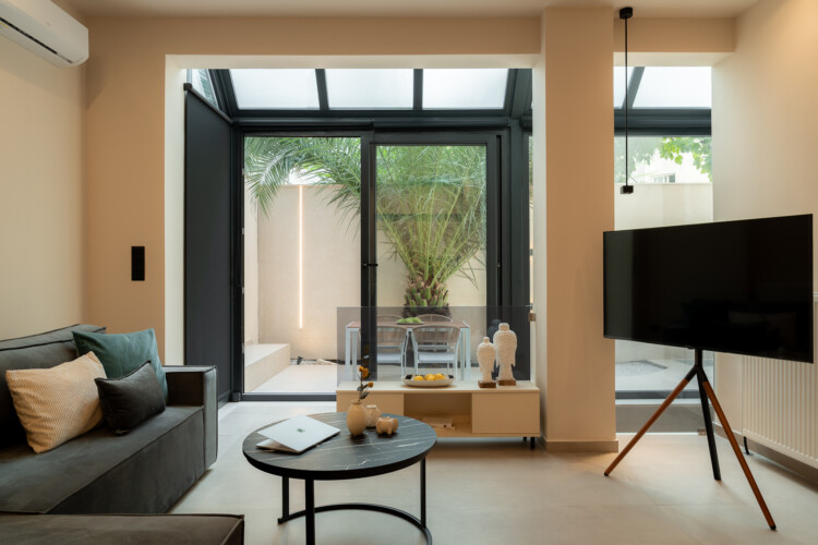 Dry Martini two-bedroom apartment in the city center with premium amenities, two bathrooms, stylish living room, and private balcony for a comfortable stay in Thessaloniki.