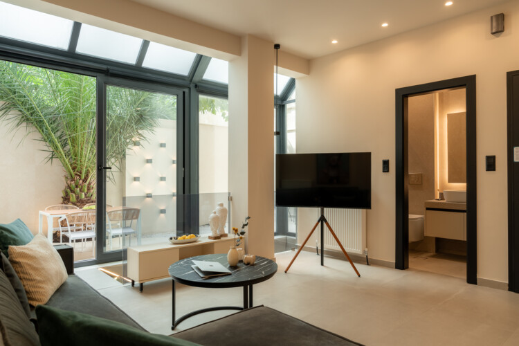 Dry Martini two-bedroom apartment in the city center with premium amenities, two bathrooms, stylish living room, and private balcony for a comfortable stay in Thessaloniki.