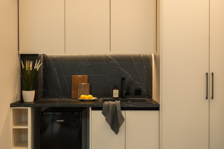 Dry Martini two-bedroom apartment in the city center with premium amenities, two bathrooms, stylish living room, and private balcony for a comfortable stay in Thessaloniki.