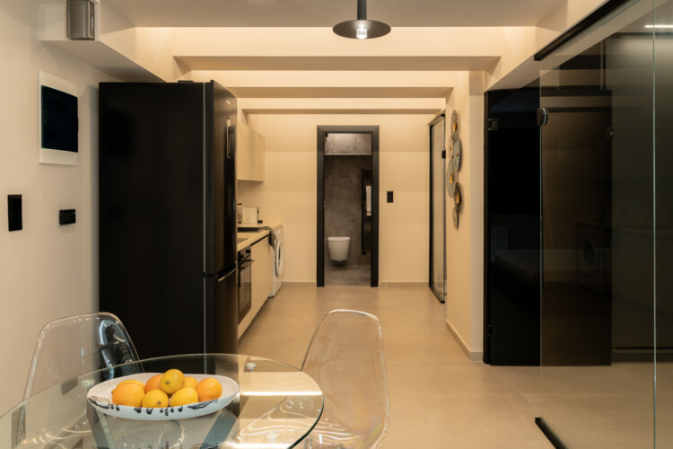 Dry Martini two-bedroom apartment in the city center with premium amenities, two bathrooms, stylish living room, and private balcony for a comfortable stay in Thessaloniki.