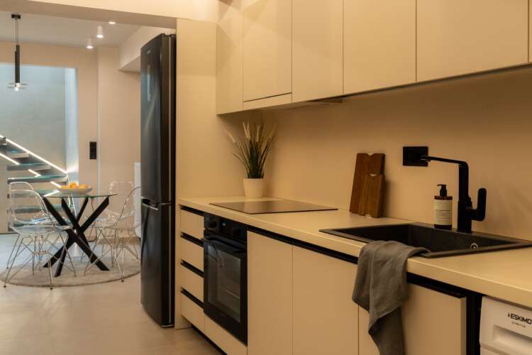 Dry Martini two-bedroom apartment in the city center with premium amenities, two bathrooms, stylish living room, and private balcony for a comfortable stay in Thessaloniki.