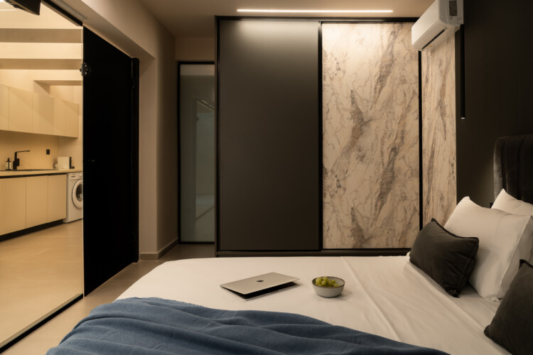 Dry Martini two-bedroom apartment in the city center with premium amenities, two bathrooms, stylish living room, and private balcony for a comfortable stay in Thessaloniki.