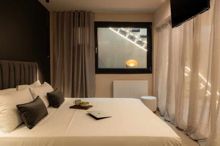 Dry Martini two-bedroom apartment in the city center with premium amenities, two bathrooms, stylish living room, and private balcony for a comfortable stay in Thessaloniki.