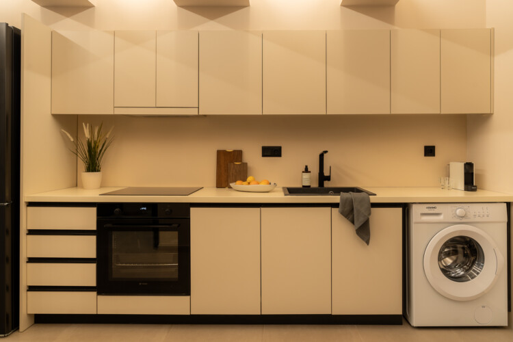 Dry Martini two-bedroom apartment in the city center with premium amenities, two bathrooms, stylish living room, and private balcony for a comfortable stay in Thessaloniki.