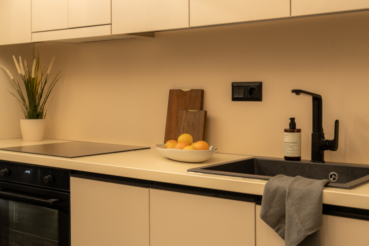 Dry Martini two-bedroom apartment in the city center with premium amenities, two bathrooms, stylish living room, and private balcony for a comfortable stay in Thessaloniki.