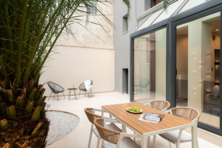Dry Martini two-bedroom apartment in the city center with premium amenities, two bathrooms, stylish living room, and private balcony for a comfortable stay in Thessaloniki.