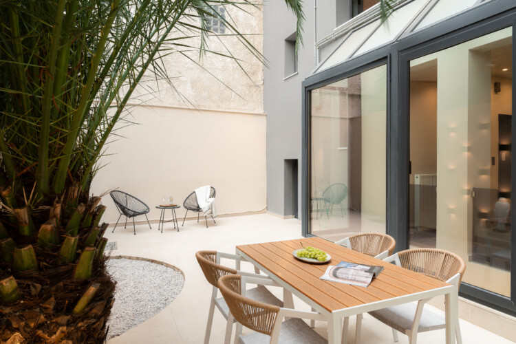 Dry Martini two-bedroom apartment in the city center with premium amenities, two bathrooms, stylish living room, and private balcony for a comfortable stay in Thessaloniki.