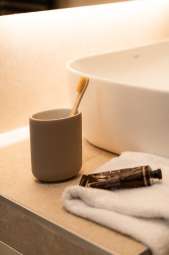 Dry Martini two-bedroom apartment in the city center with premium amenities, two bathrooms, stylish living room, and private balcony for a comfortable stay in Thessaloniki.