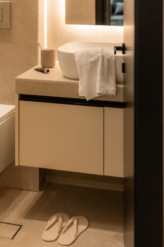 Dry Martini two-bedroom apartment in the city center with premium amenities, two bathrooms, stylish living room, and private balcony for a comfortable stay in Thessaloniki.