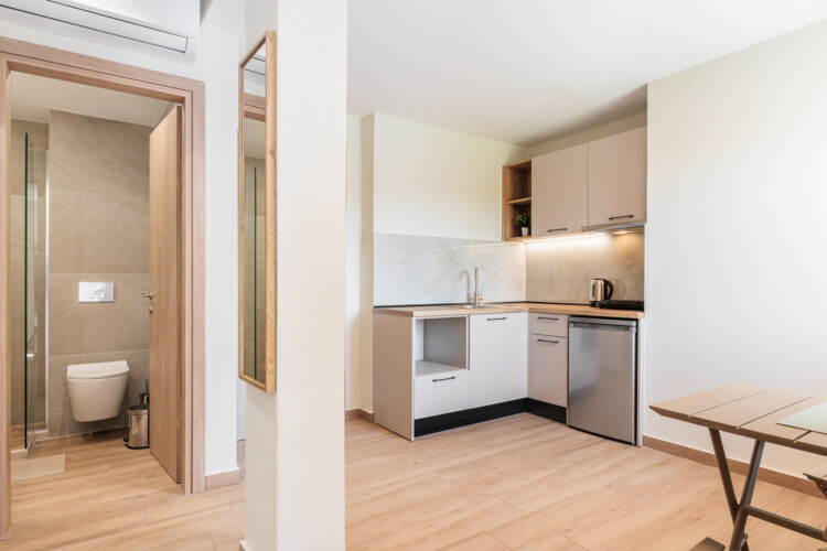 "KYMA STAY beachfront apartments in Palioura Epanomi, offering one-bedroom and two-bedroom options next to Kyma Beach Bar for a relaxing seaside getaway in Greece.