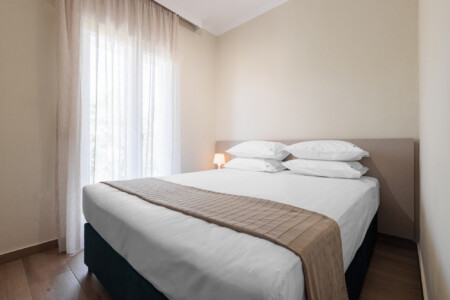 "KYMA STAY beachfront apartments in Palioura Epanomi, offering one-bedroom and two-bedroom options next to Kyma Beach Bar for a relaxing seaside getaway in Greece.