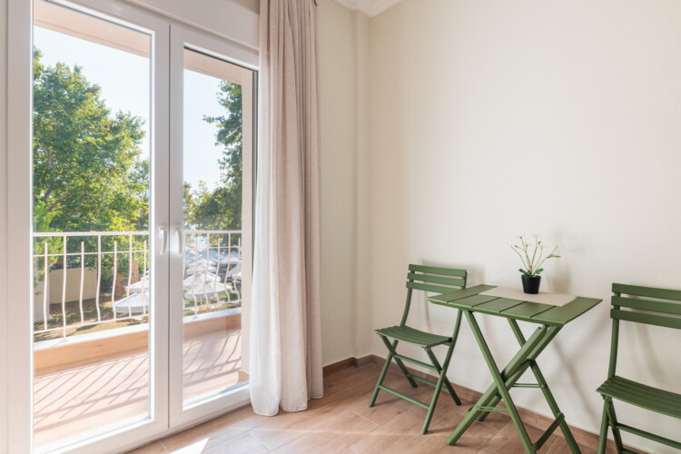 "KYMA STAY beachfront apartments in Palioura Epanomi, offering one-bedroom and two-bedroom options next to Kyma Beach Bar for a relaxing seaside getaway in Greece.