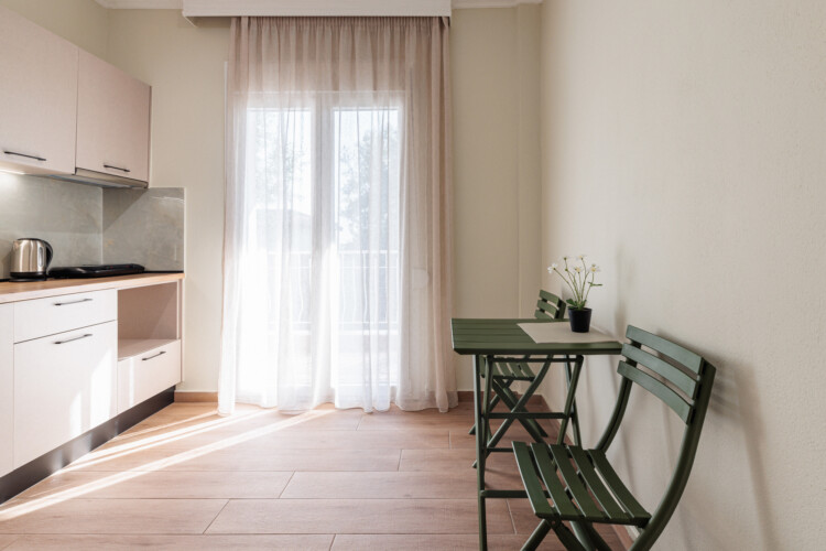 "KYMA STAY beachfront apartments in Palioura Epanomi, offering one-bedroom and two-bedroom options next to Kyma Beach Bar for a relaxing seaside getaway in Greece.