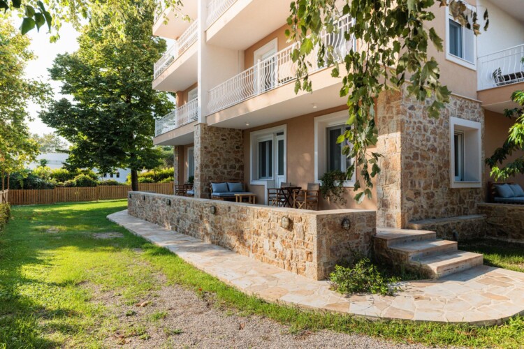 "KYMA STAY beachfront apartments in Palioura Epanomi, offering one-bedroom and two-bedroom options next to Kyma Beach Bar for a relaxing seaside getaway in Greece.