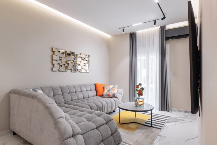 Dry Martini two-bedroom apartment in the city center with premium amenities, two bathrooms, stylish living room, and private balcony for a comfortable stay in Thessaloniki.