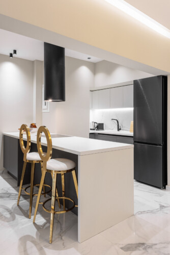 Dry Martini two-bedroom apartment in the city center with premium amenities, two bathrooms, stylish living room, and private balcony for a comfortable stay in Thessaloniki.