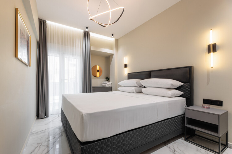 Dry Martini two-bedroom apartment in the city center with premium amenities, two bathrooms, stylish living room, and private balcony for a comfortable stay in Thessaloniki.