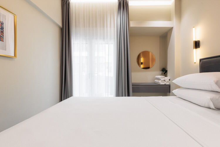 Dry Martini two-bedroom apartment in the city center with premium amenities, two bathrooms, stylish living room, and private balcony for a comfortable stay in Thessaloniki.