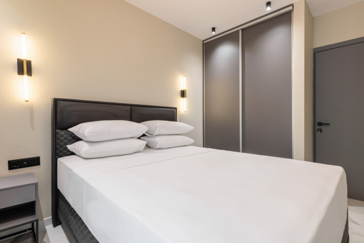 Dry Martini two-bedroom apartment in the city center with premium amenities, two bathrooms, stylish living room, and private balcony for a comfortable stay in Thessaloniki.