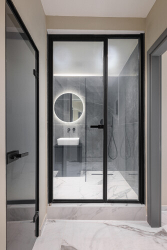 Dry Martini two-bedroom apartment in the city center with premium amenities, two bathrooms, stylish living room, and private balcony for a comfortable stay in Thessaloniki.