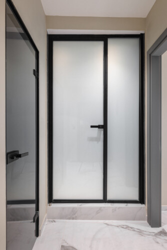 Dry Martini two-bedroom apartment in the city center with premium amenities, two bathrooms, stylish living room, and private balcony for a comfortable stay in Thessaloniki.