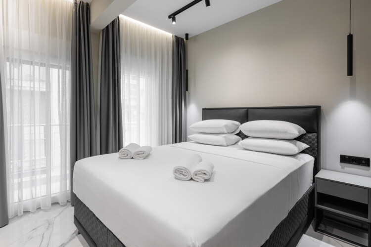 Dry Martini two-bedroom apartment in the city center with premium amenities, two bathrooms, stylish living room, and private balcony for a comfortable stay in Thessaloniki.