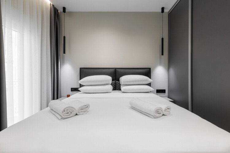 Dry Martini two-bedroom apartment in the city center with premium amenities, two bathrooms, stylish living room, and private balcony for a comfortable stay in Thessaloniki.