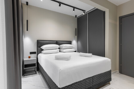 Dry Martini two-bedroom apartment in the city center with premium amenities, two bathrooms, stylish living room, and private balcony for a comfortable stay in Thessaloniki.