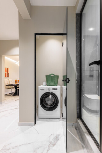 Dry Martini two-bedroom apartment in the city center with premium amenities, two bathrooms, stylish living room, and private balcony for a comfortable stay in Thessaloniki.