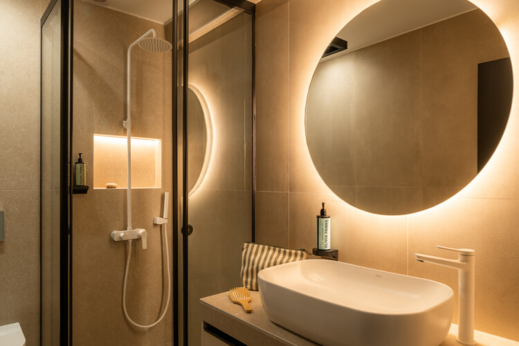 Modern loft bathroom with walk-in rain shower at FOS Apartments in Thessaloniki
