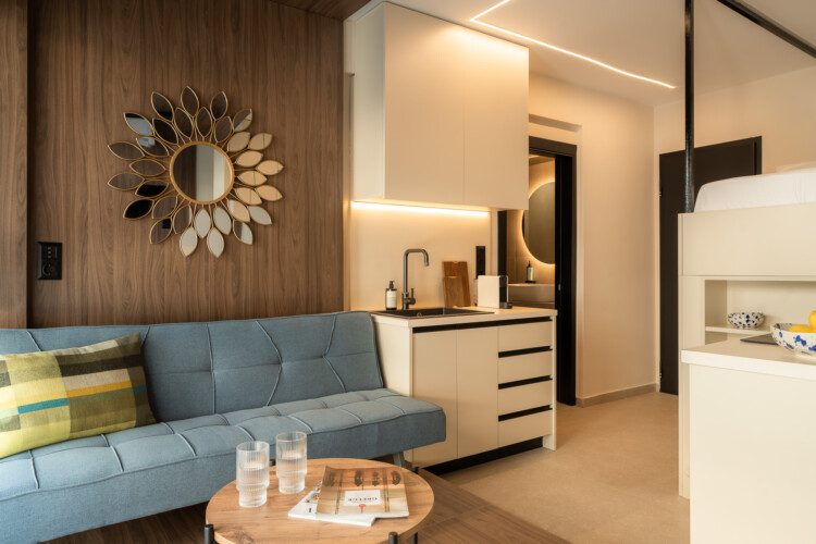 Bright living area with blue sofa and wall decor at FOS Apartments Loft