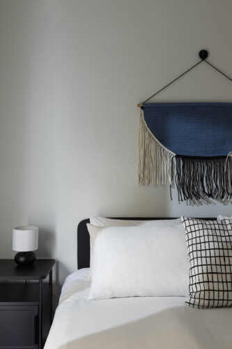 Halu! Discover serene bedroom decor by Indiana by halu! with stylish wall hangings and cozy pillows creating a peaceful and inviting atmosphere.