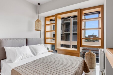 Halu! Modern and stylish bedroom interior at Verde premium apartments featuring cozy bed large windows with natural light and elegant decor for ultimate comfort and luxury living.